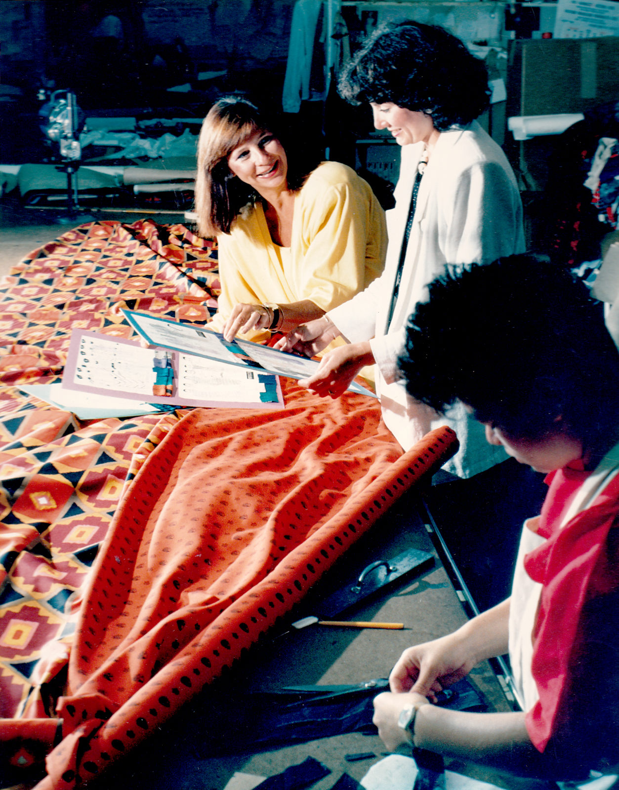 Discussing fabric options with the sales rep, 1980s. Discussing fabric options with the sales rep, 1980s.